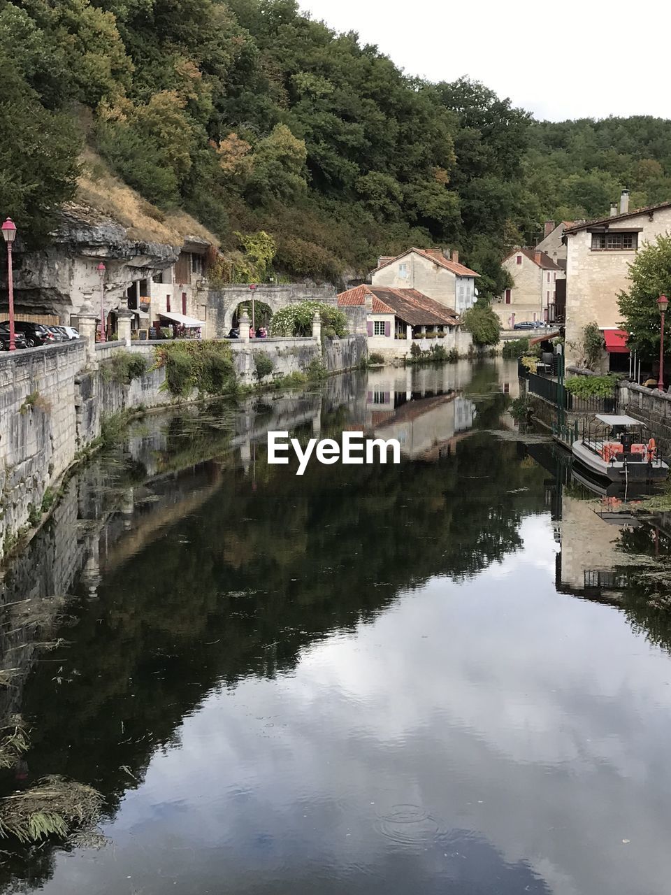 REFLECTION OF BUILDINGS ON LAKE