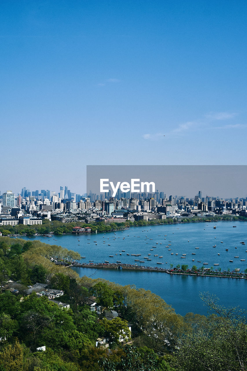 Scenic view of sea and buildings against sky