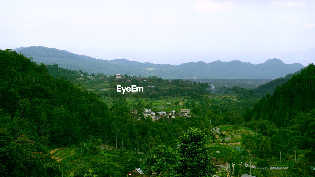 Scenic view of landscape and mountains against sky