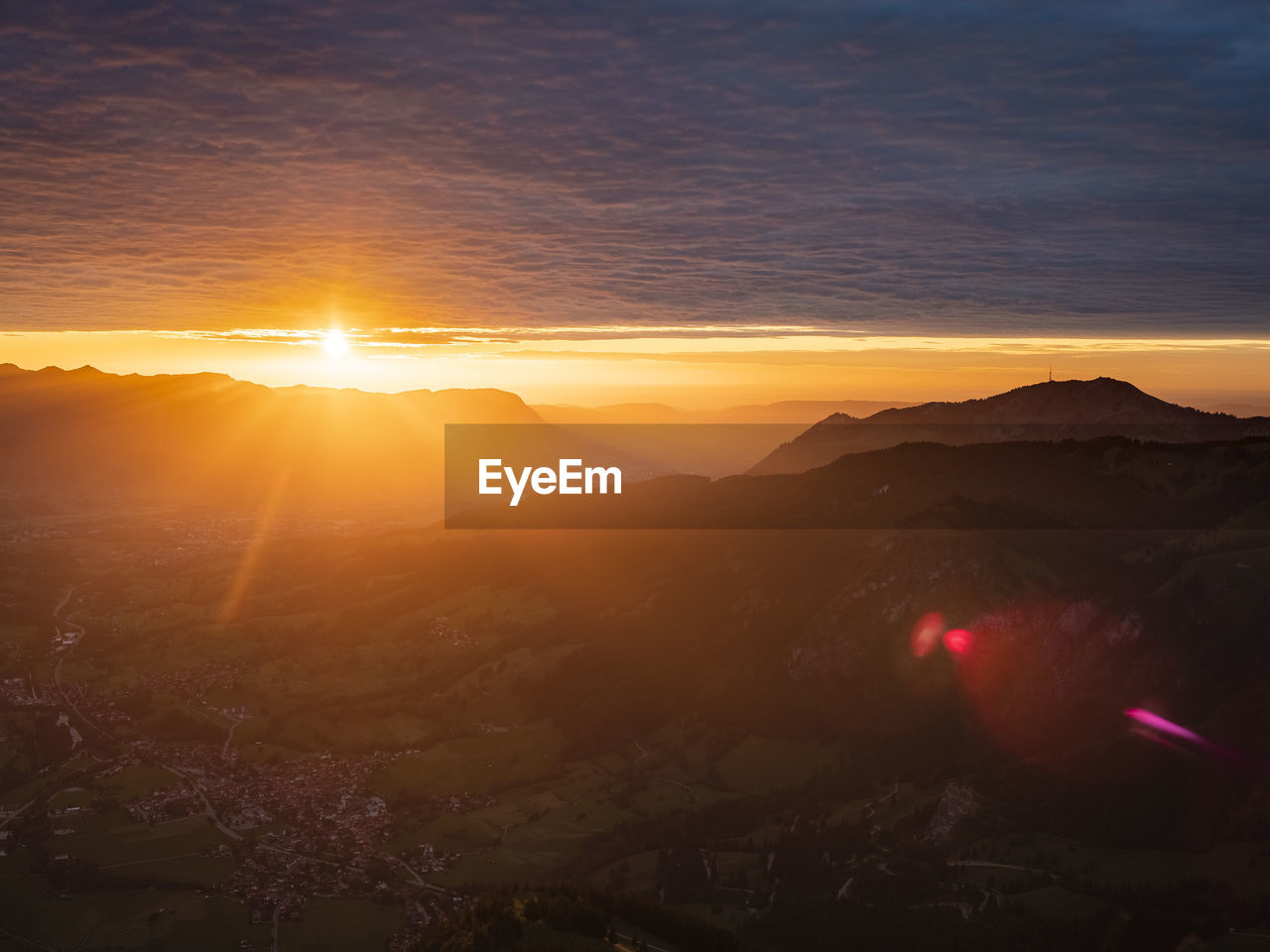 Scenic view of silhouette mountains against sky during sunset