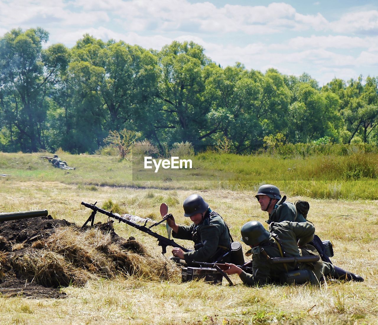 GROUP OF PEOPLE IN FIELD