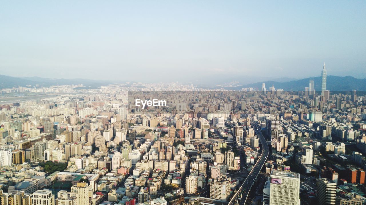 Aerial view of cityscape against sky