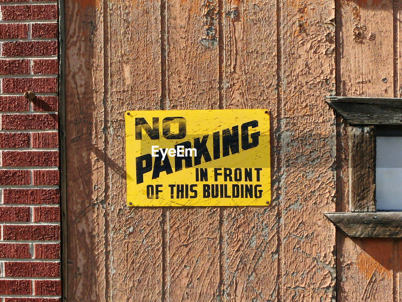 Close-up of information sign on wall