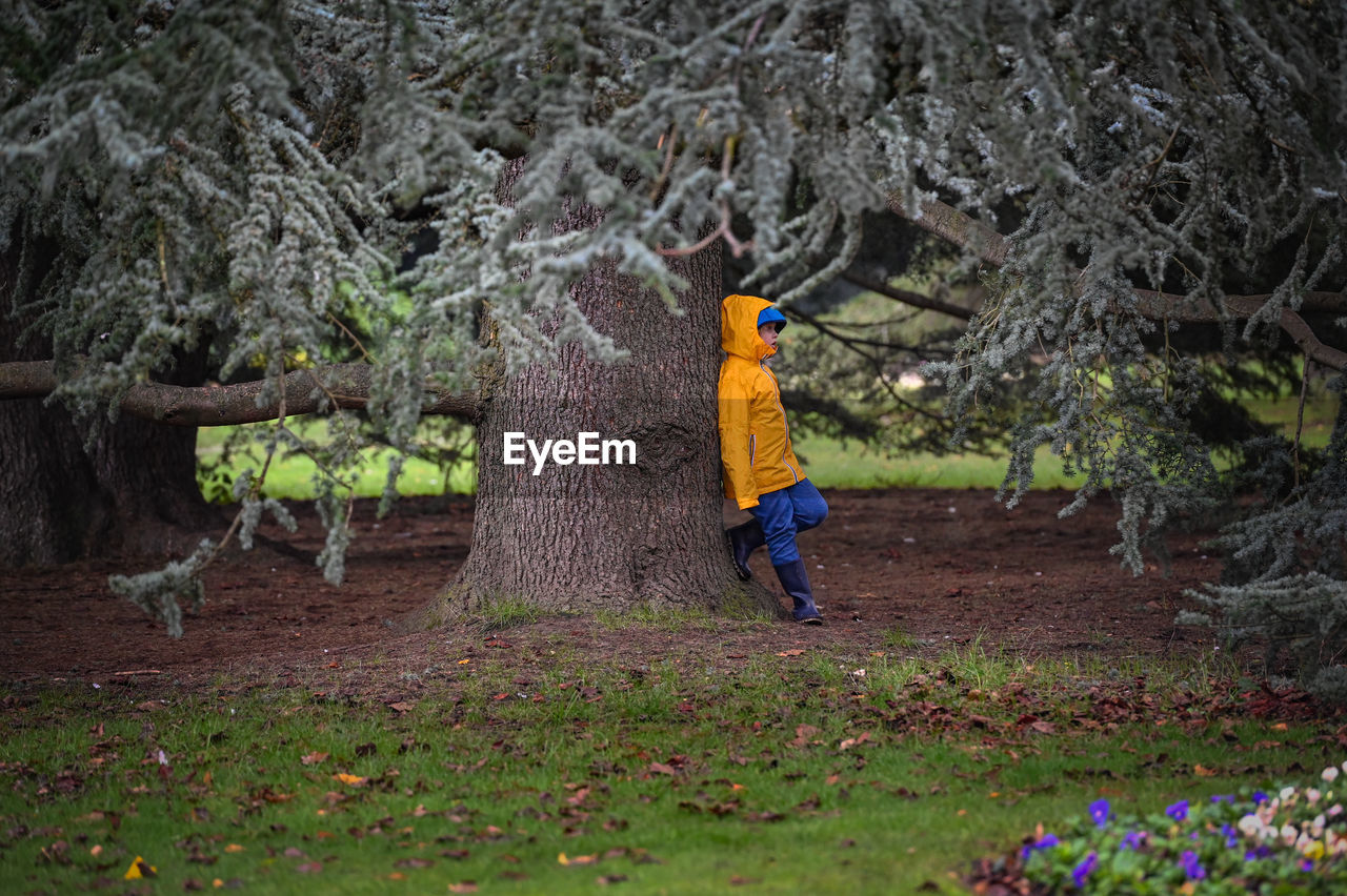 Boy in the park during autumn walk