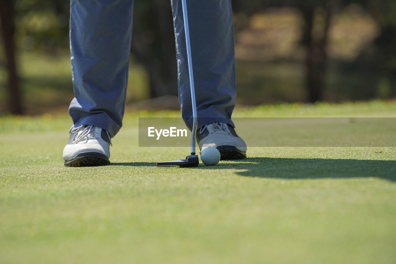 Low section of man on golf course