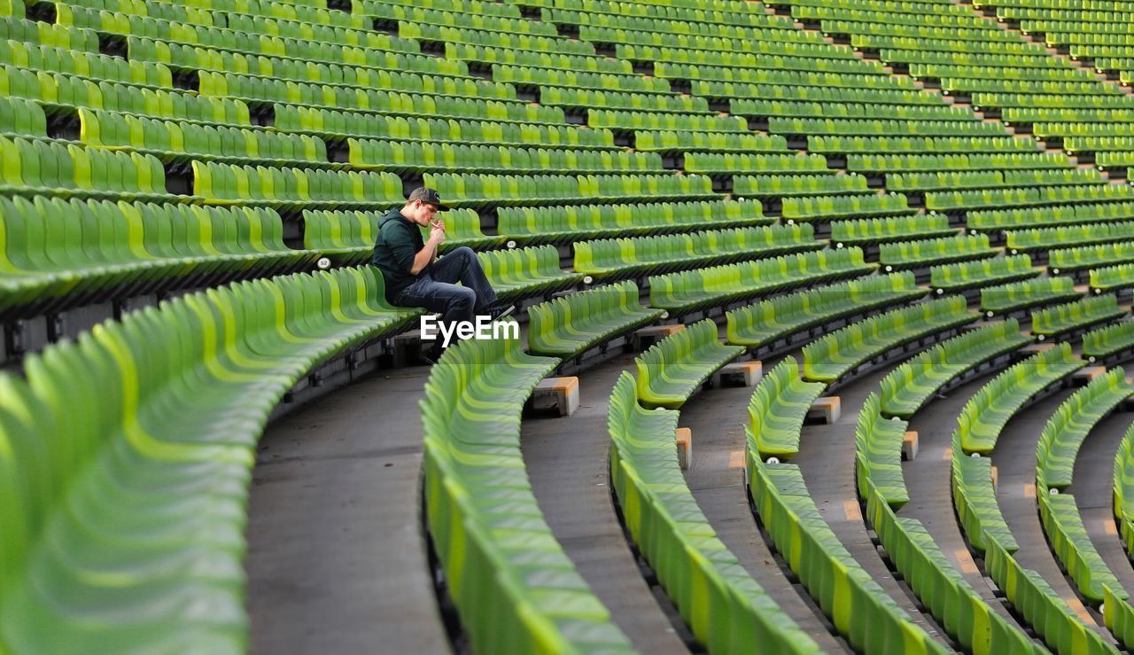 VIEW OF MEN ON GREEN LEAVES