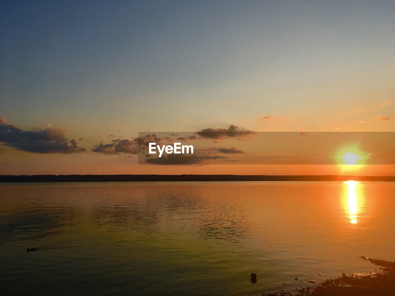 SCENIC VIEW OF SEA DURING SUNSET