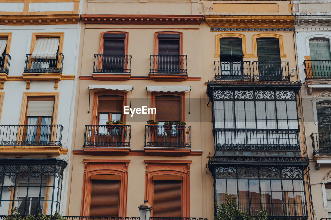 Traditional buildings on a street in seville, spain.