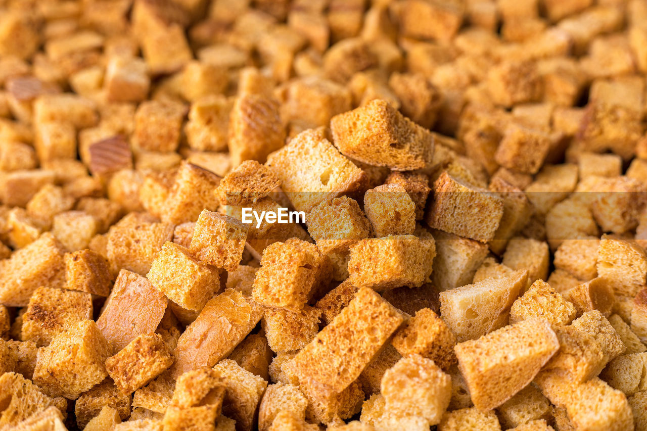 Square-shaped bread crumbs. oven-fried golden brown bread crumbs.