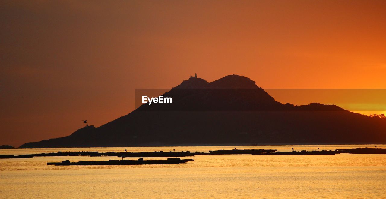 SILHOUETTE OF MOUNTAINS AT SUNSET