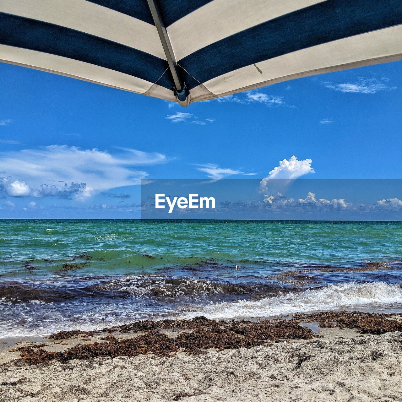 SCENIC VIEW OF SEA AGAINST BLUE SKY