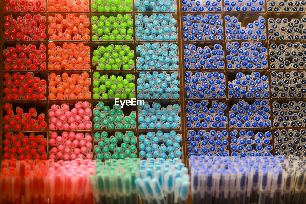 FULL FRAME SHOT OF MULTI COLORED GLASS FOR SALE AT MARKET STALL