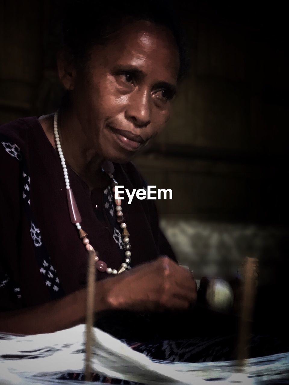 Woman making yarn at home
