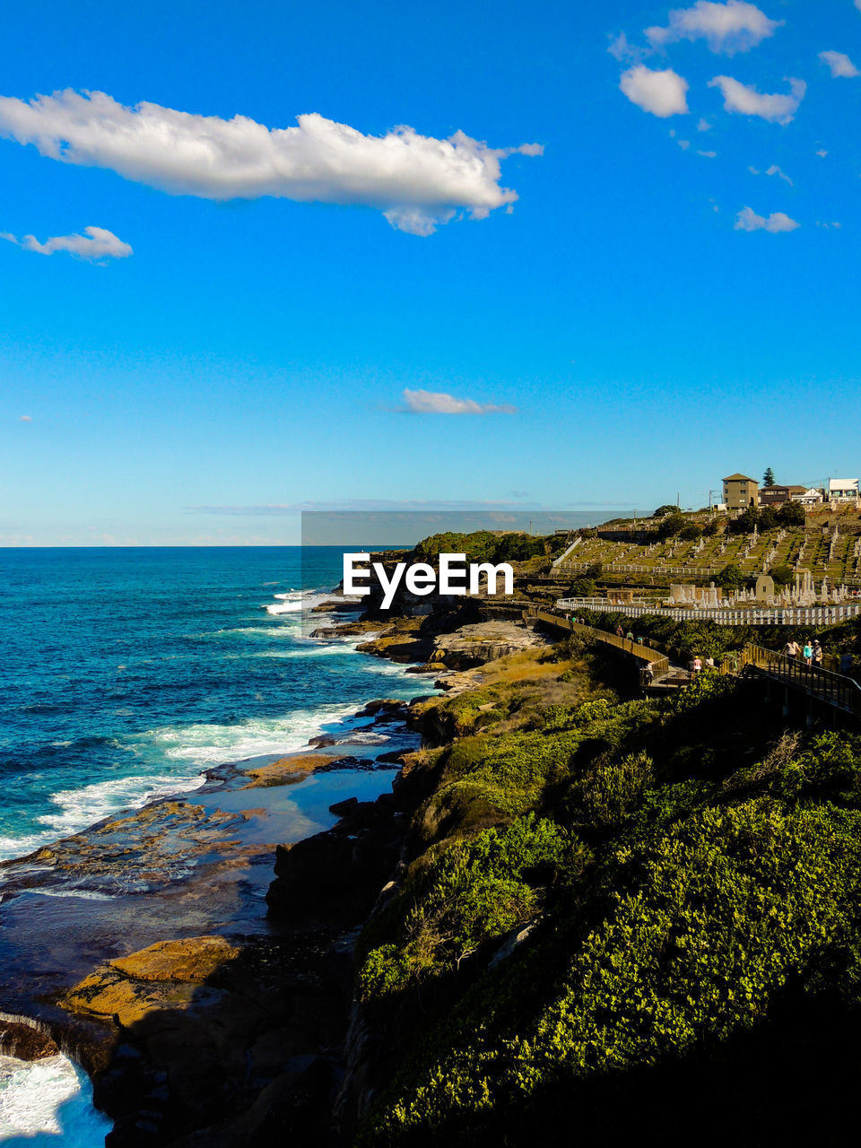 Scenic view of sea against blue sky