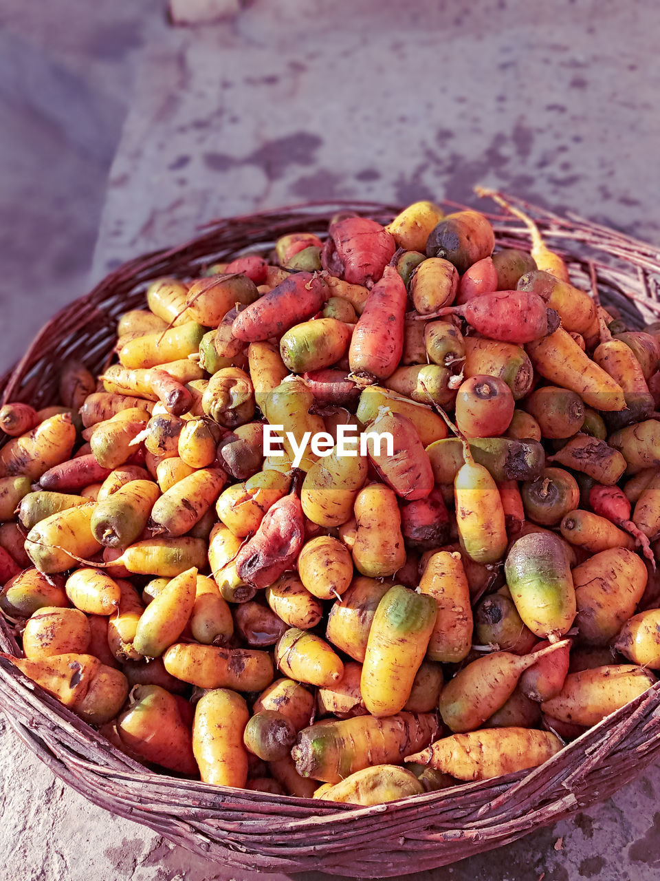 HIGH ANGLE VIEW OF FRUITS IN BASKET ON BOWL