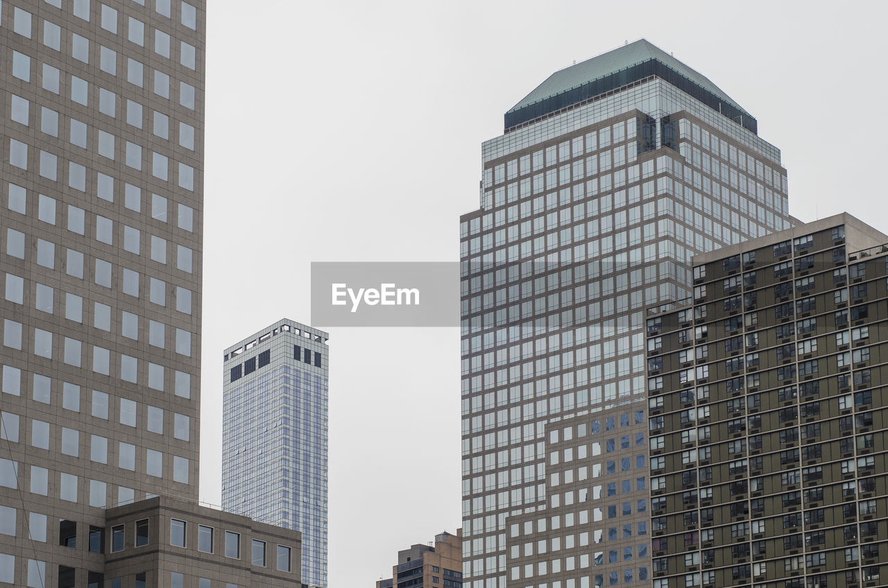 Low angle view of skyscrapers against sky