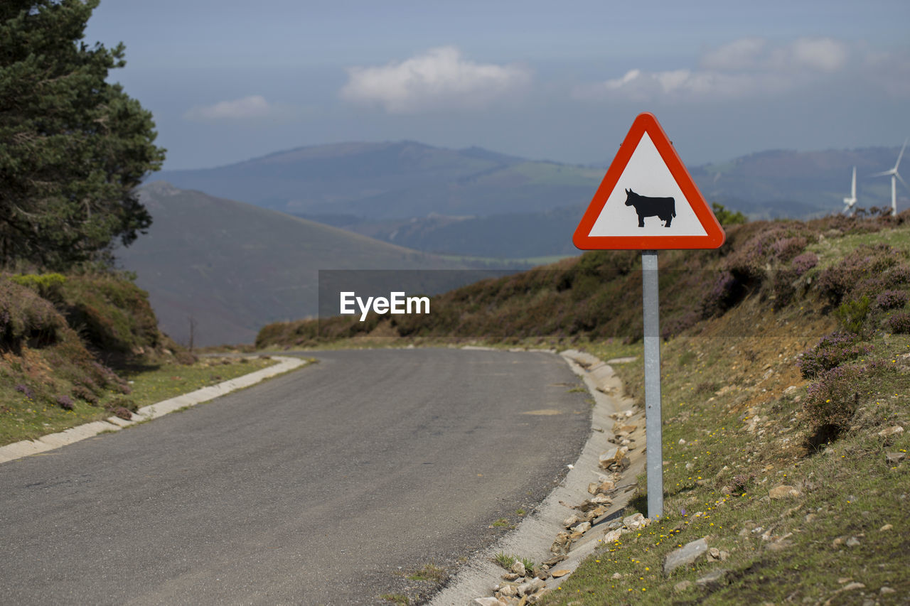 ROAD SIGN AGAINST SKY