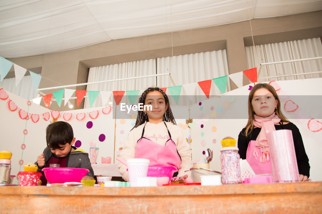 Portrait of girls at table