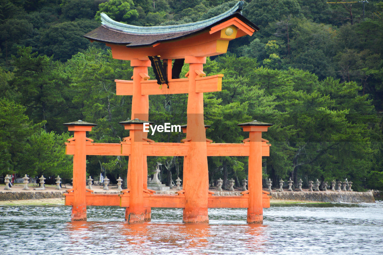 VIEW OF TEMPLE AGAINST TREES AND BUILDING