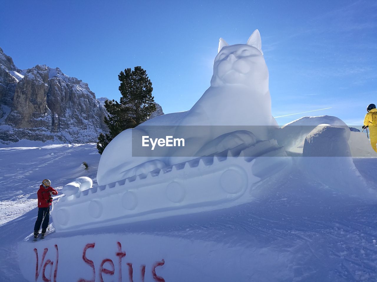 PEOPLE ON SNOWCAPPED MOUNTAIN AGAINST SKY