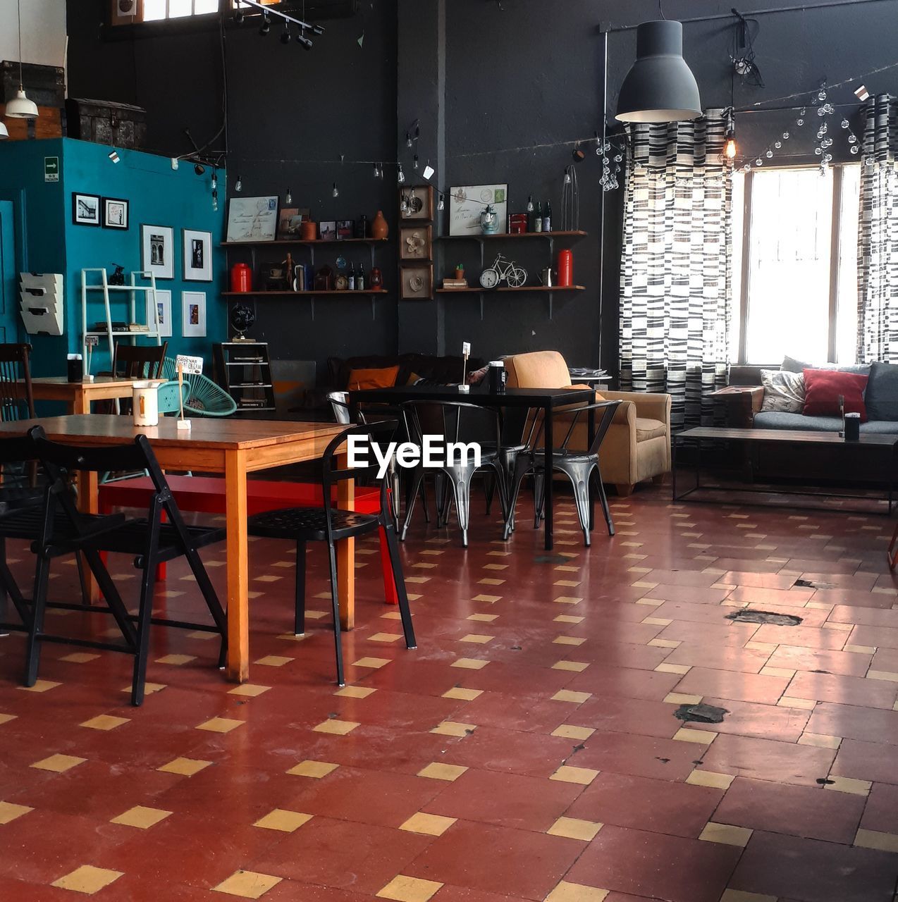 EMPTY CHAIRS AND TABLES IN CAFE AT RESTAURANT