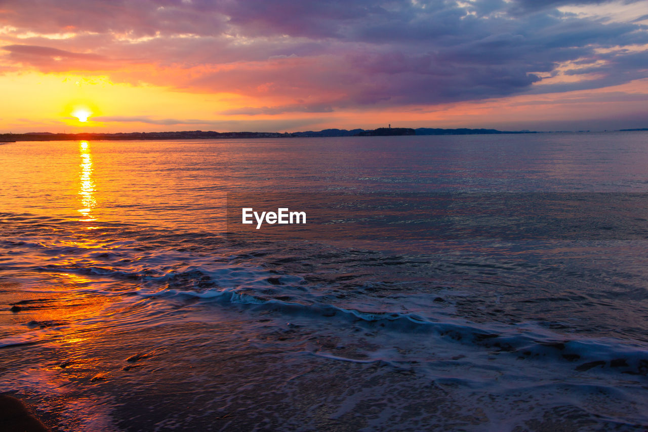 Scenic view of sea against sky during sunset