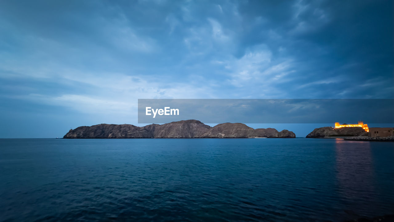 water, horizon, sky, sea, cloud, dusk, scenics - nature, ocean, nature, land, beauty in nature, travel destinations, coast, body of water, beach, bay, architecture, reflection, tranquility, no people, shore, travel, landscape, tranquil scene, environment, blue, mountain, outdoors, seascape, coastline, rock, island, sunset, city, built structure, building exterior, evening, tourism, bay of water, night, holiday, trip, idyllic