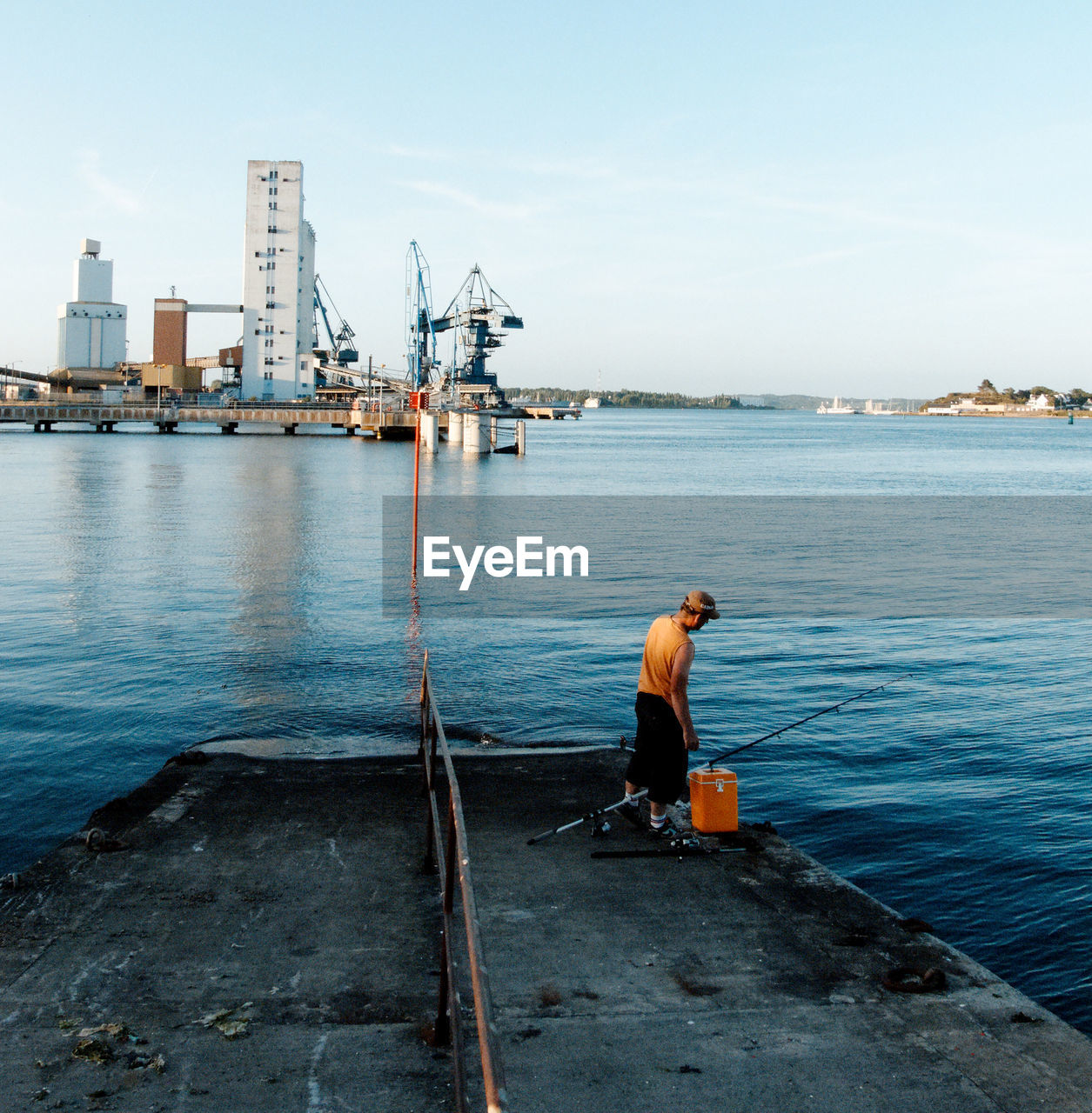 MAN WORKING AT HARBOR