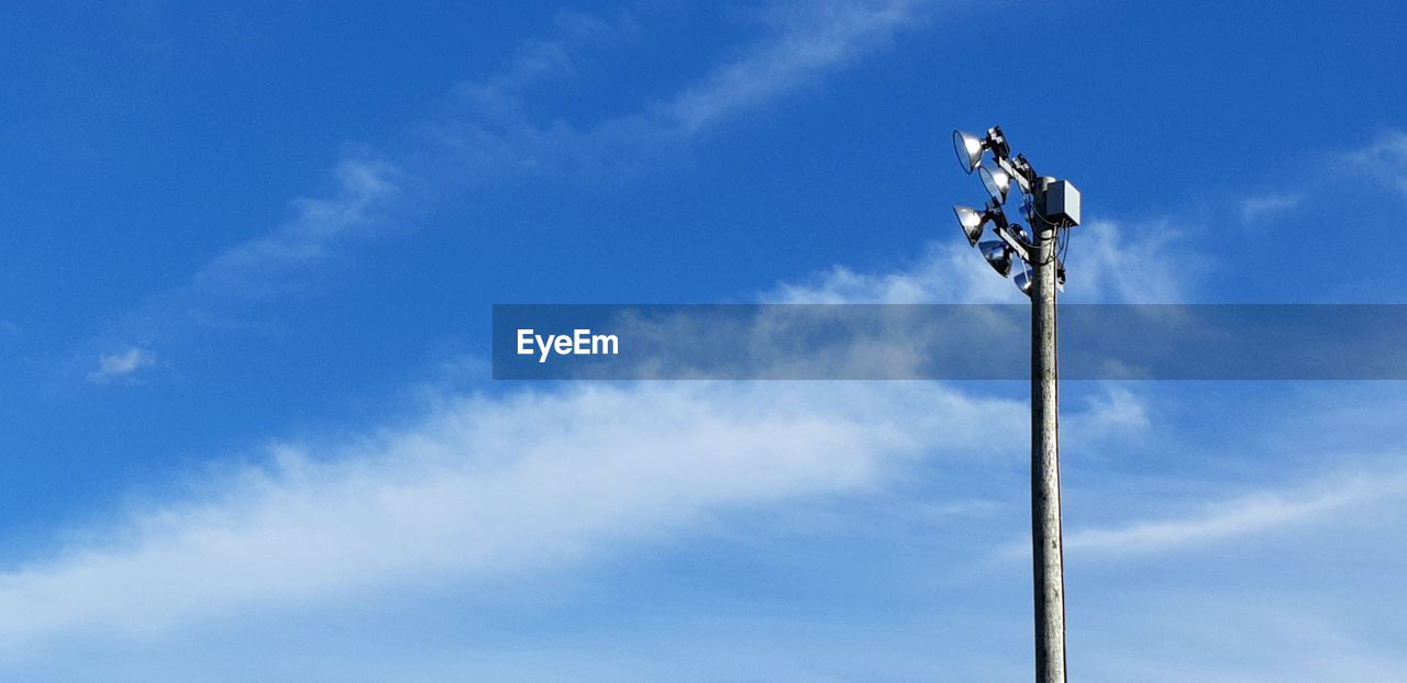 Low angle view of floodlight against sky