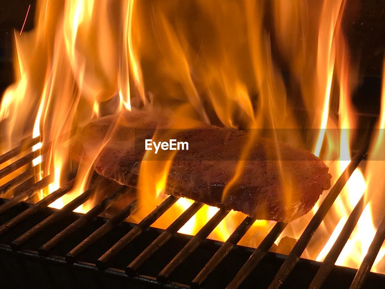 CLOSE-UP OF BONFIRE ON BARBECUE