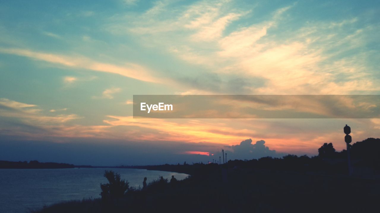 Scenic view of silhouette trees against sky during sunset