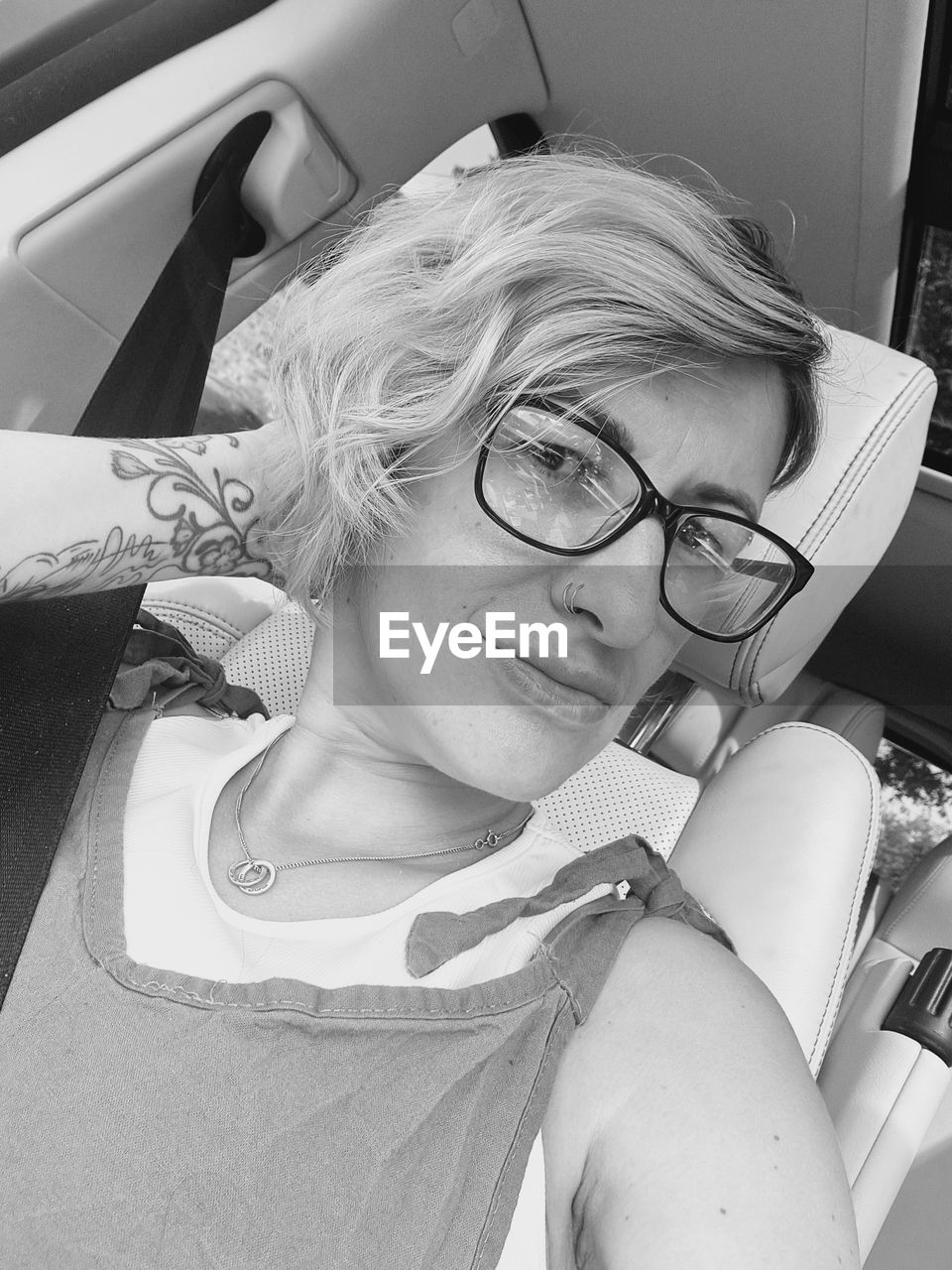 white, black and white, glasses, one person, eyeglasses, monochrome photography, women, monochrome, adult, eyewear, vision care, portrait, black, lifestyles, person, indoors, blond hair, leisure activity, female, young adult, high angle view, headshot, human face, fashion, clothing, sunglasses, lying down, relaxation, hairstyle