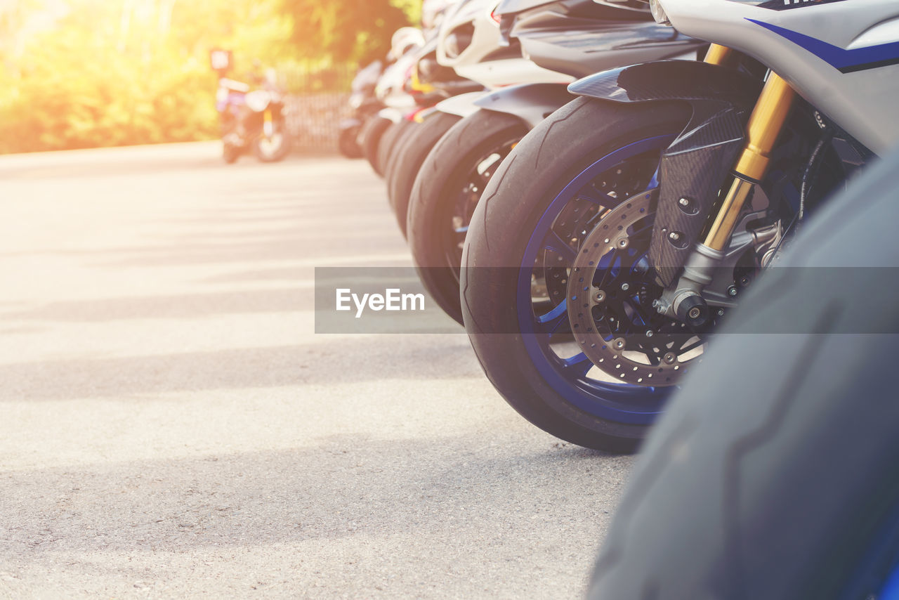 Close-up of motorcycles at parking lot