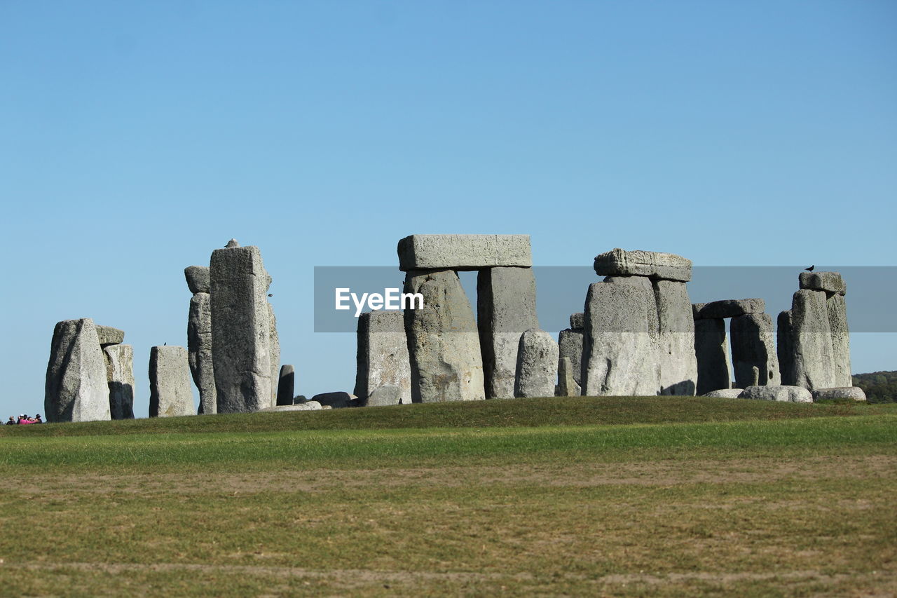 Built structure on field against clear sky