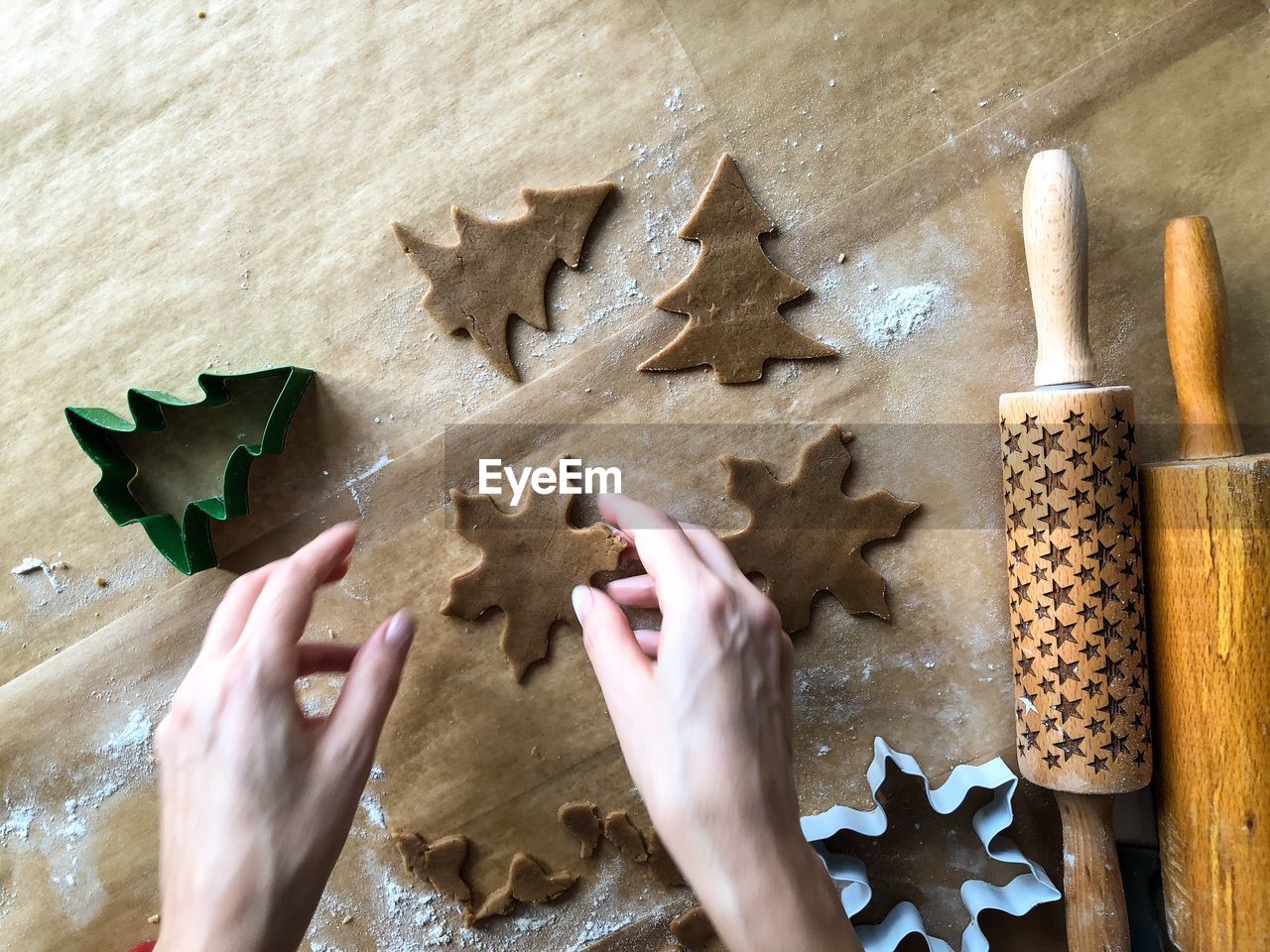 Cropped image of hand making cookies