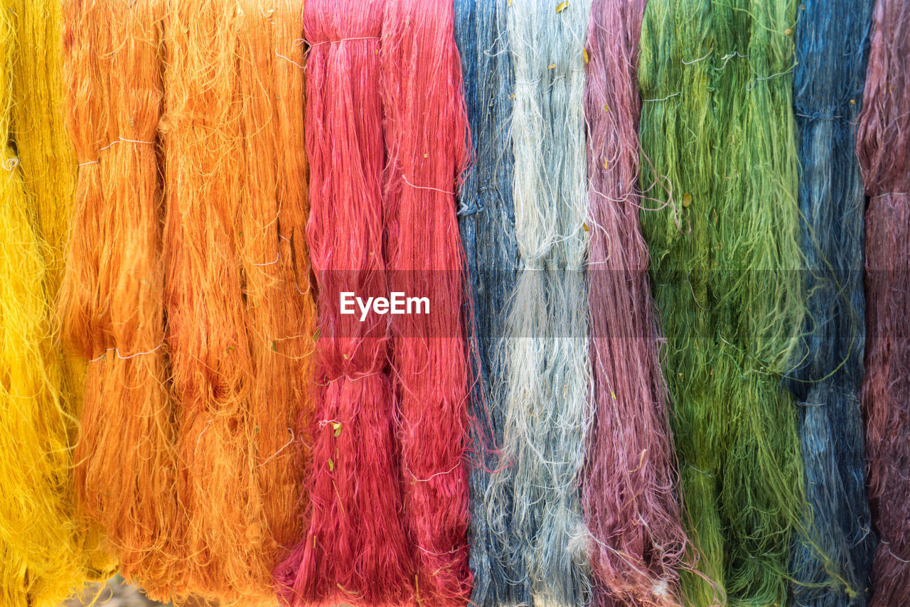 Full frame shot of colorful silk ropes hanging for sale