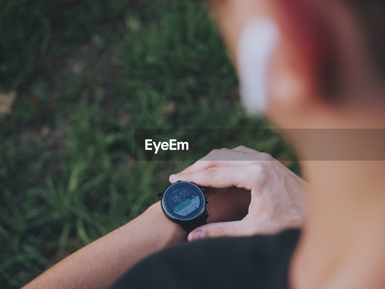 Cropped image of person wearing smart watch