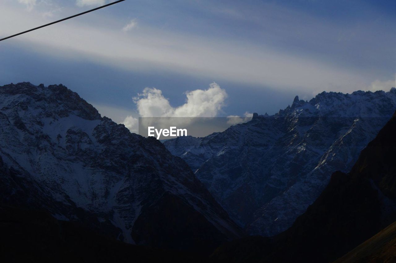 SCENIC VIEW OF SNOWCAPPED MOUNTAIN AGAINST SKY