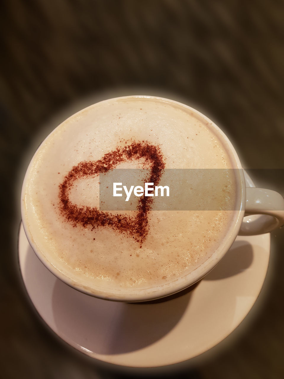 CLOSE-UP OF COFFEE IN CUP ON TABLE