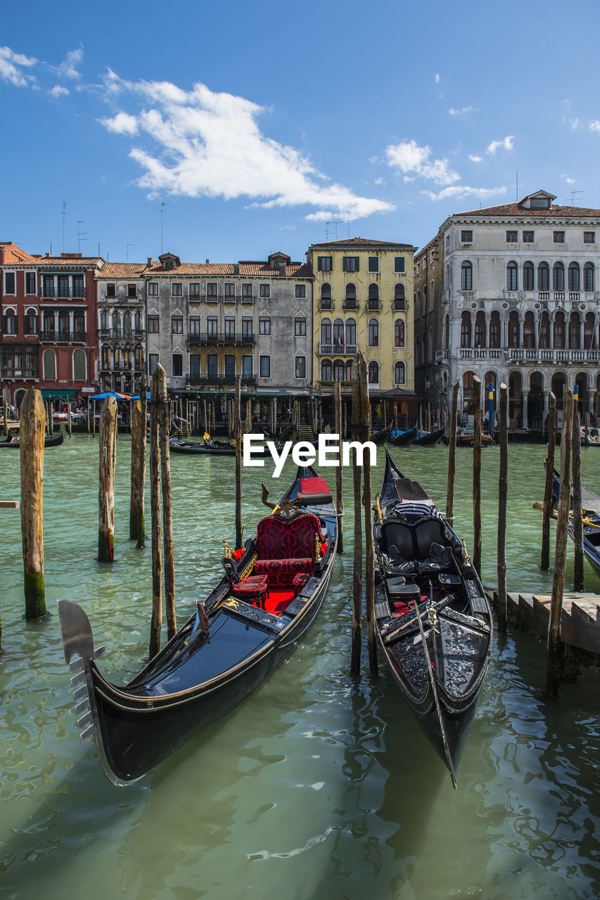 Gondolas parked at canal grande in venice