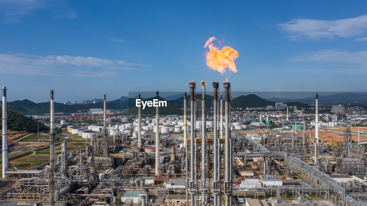 Aerial top view oil and gas refinery petrochemical plant industrial with oil and gas storage tank.