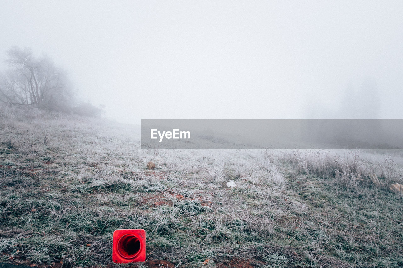 Scenic view of field against sky during winter