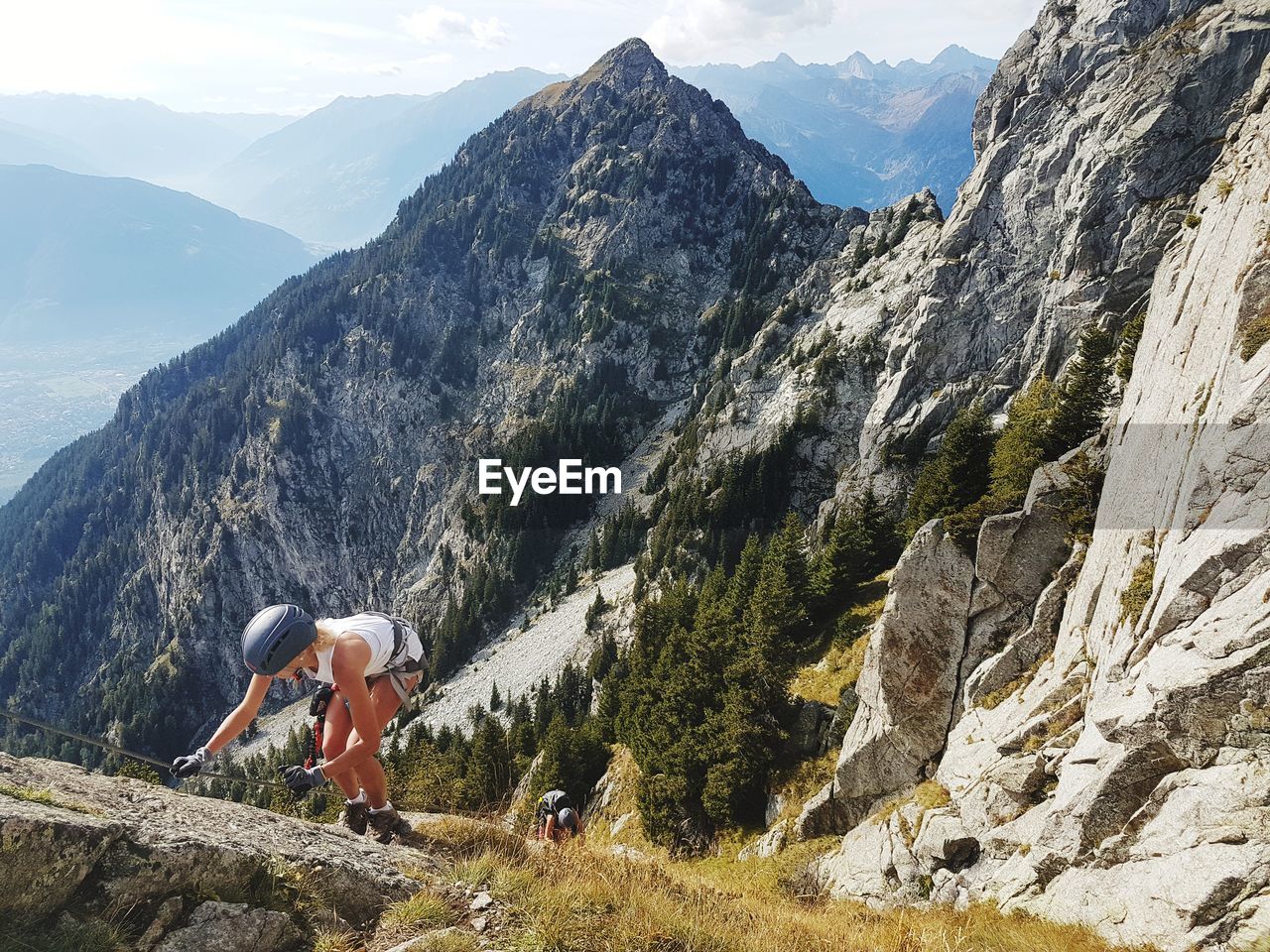 Woman climbing mountains