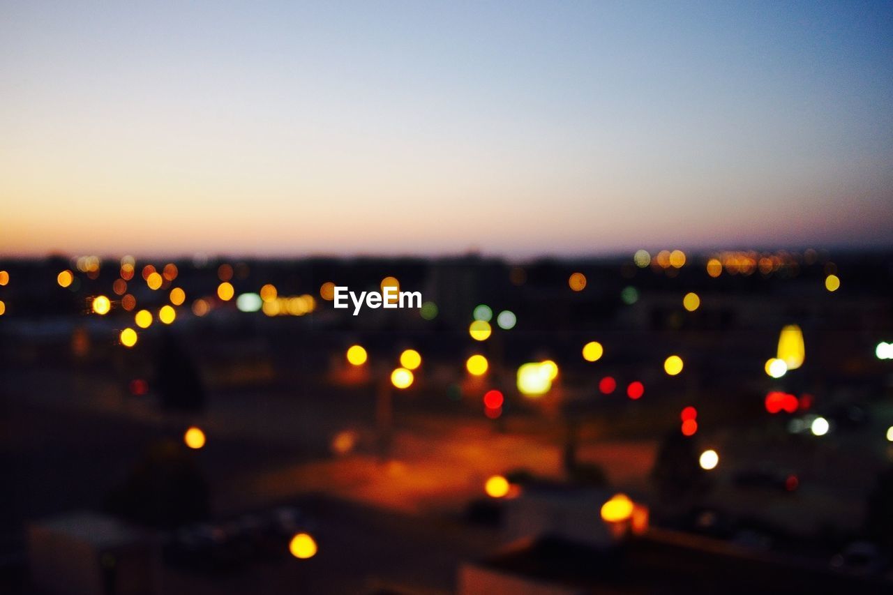 High angle view of defocused city lights