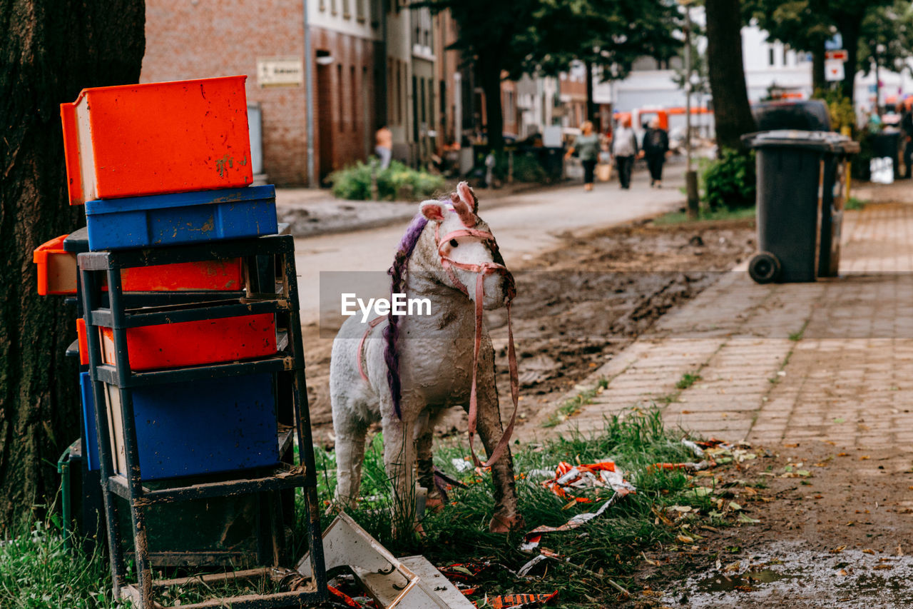 After the devastating flood disaster, people put their belongings by the street. 