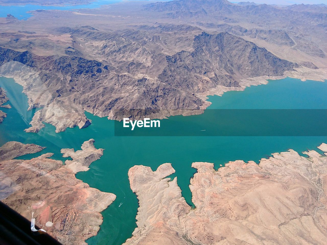 High angle view of lake by mountain