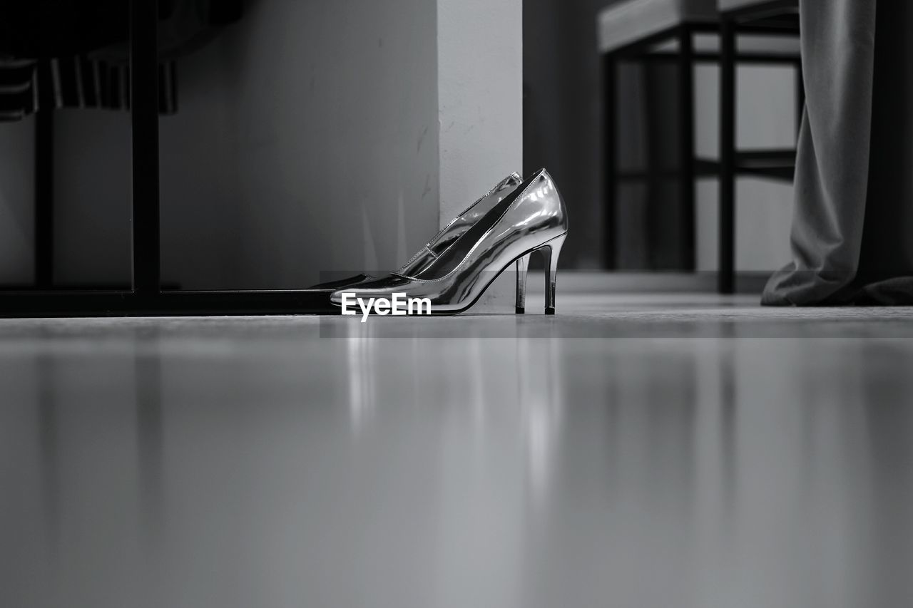 Surface level view of high heel shoes indoors