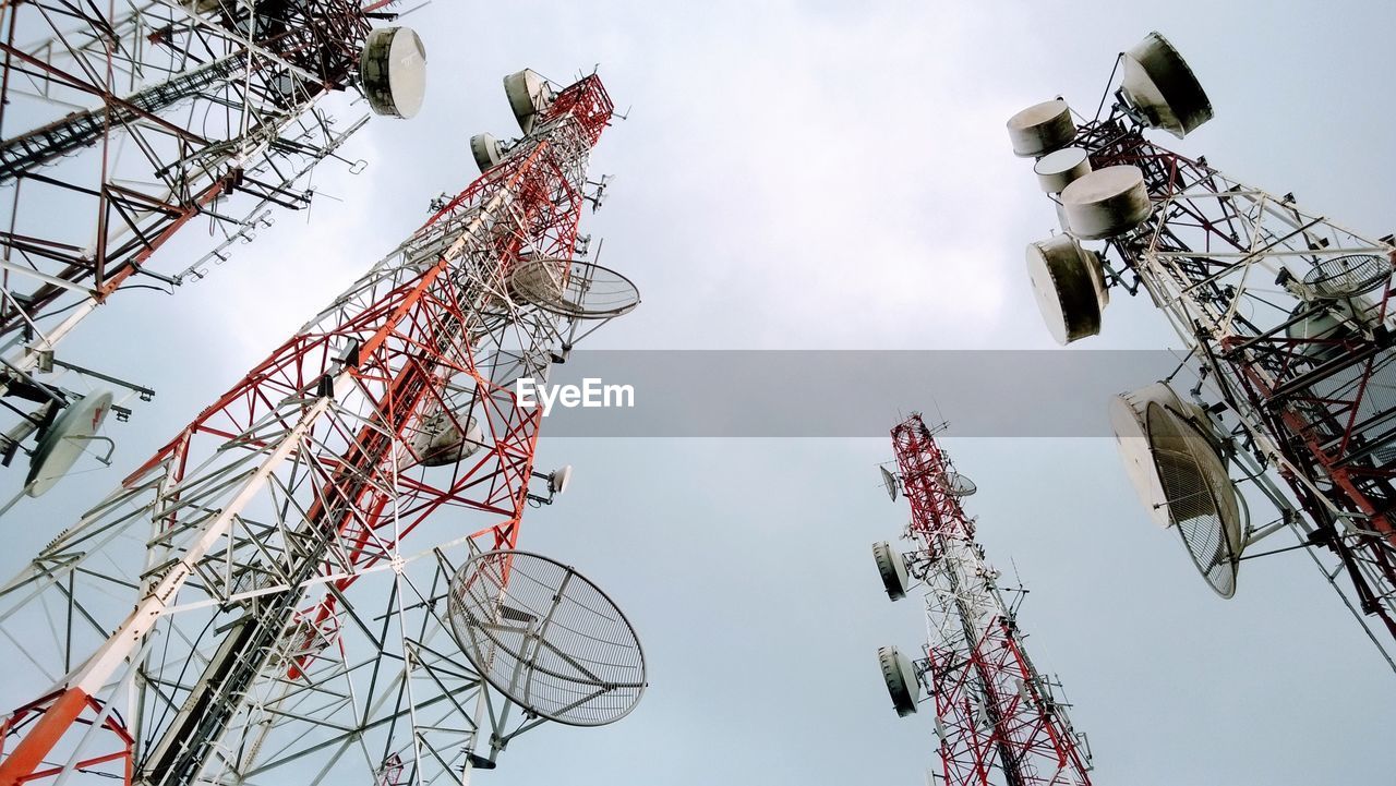 Low angle view of communications tower against sky