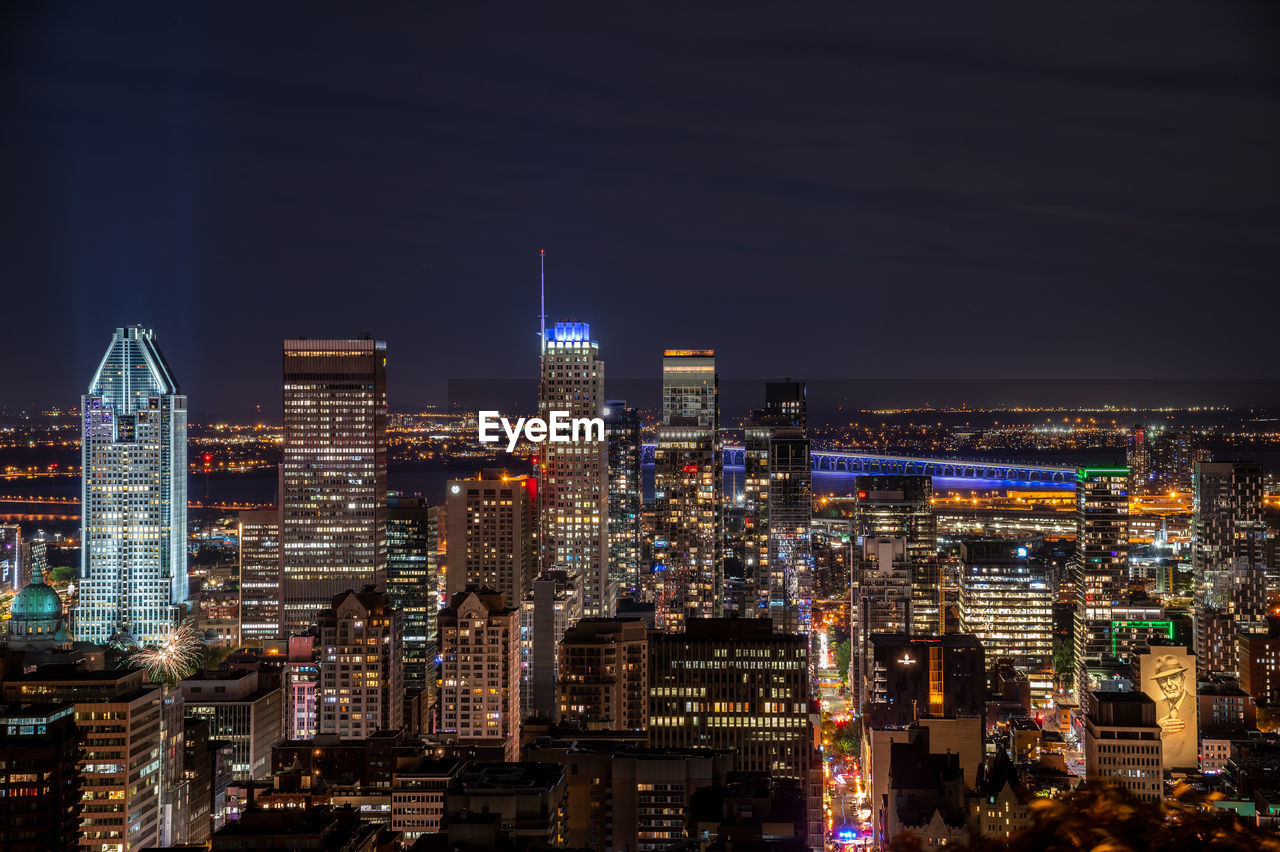 Illuminated buildings in city at night