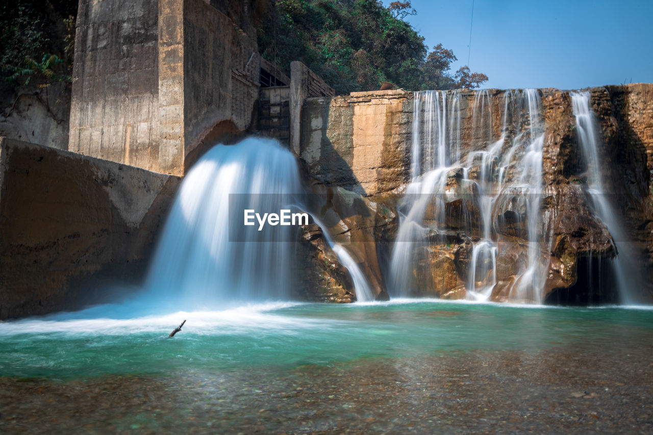 View of waterfall in sea